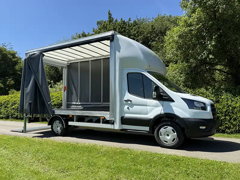 View of the Electric Ford E-Transit Curtain Side