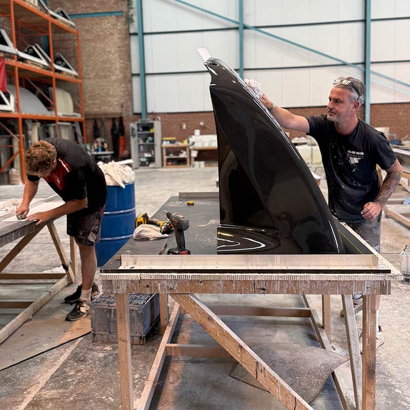 The team working on glass fibre panels